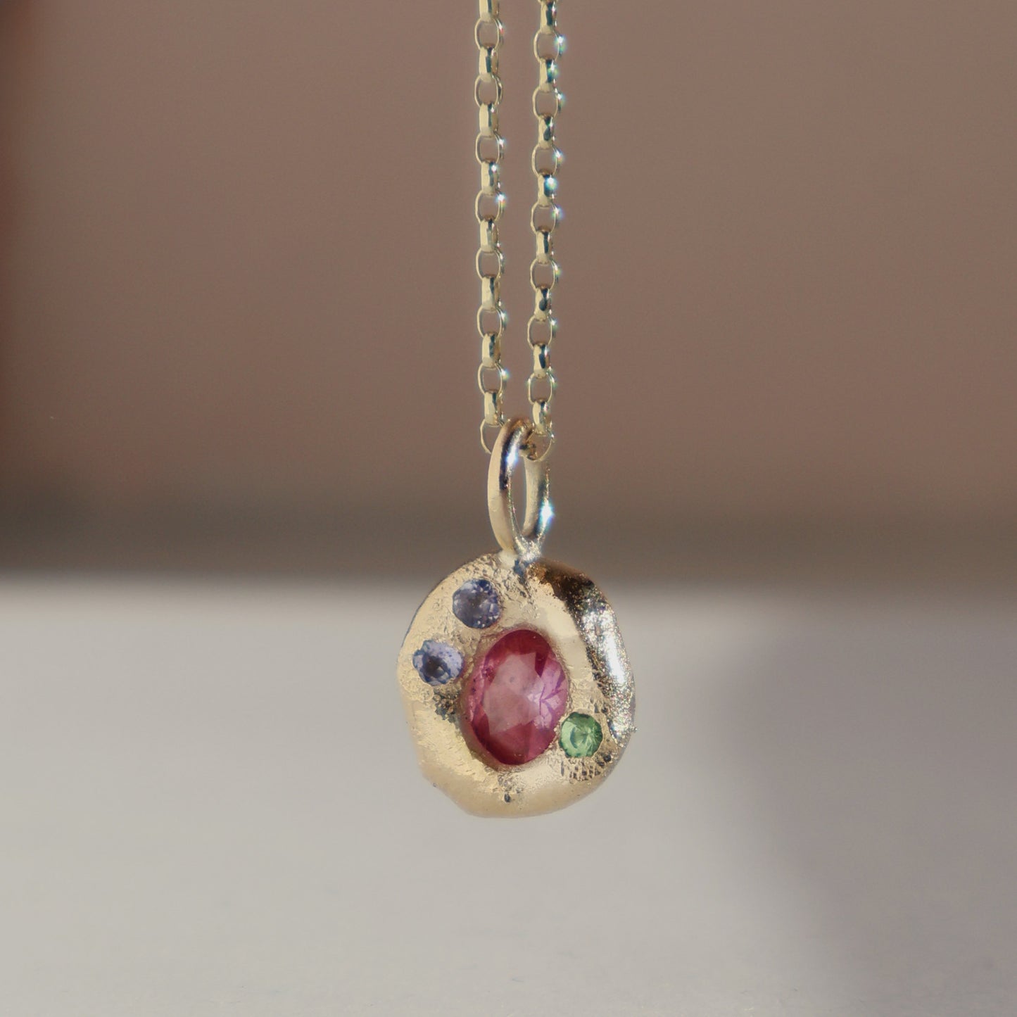 Molten Pendant  - 9ct Gold - Oval Pink Sapphire with Tanzanites and Tsavorite